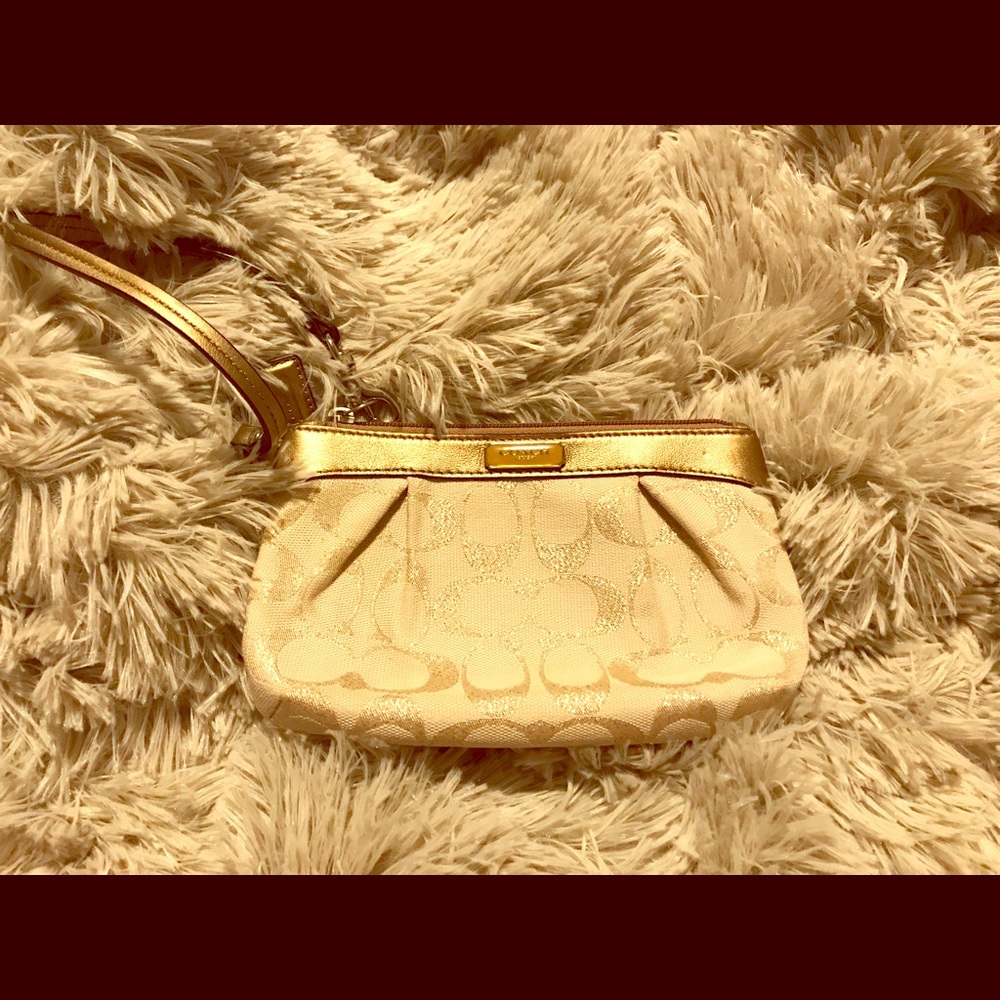 Gold Coach logo wristlet clutch